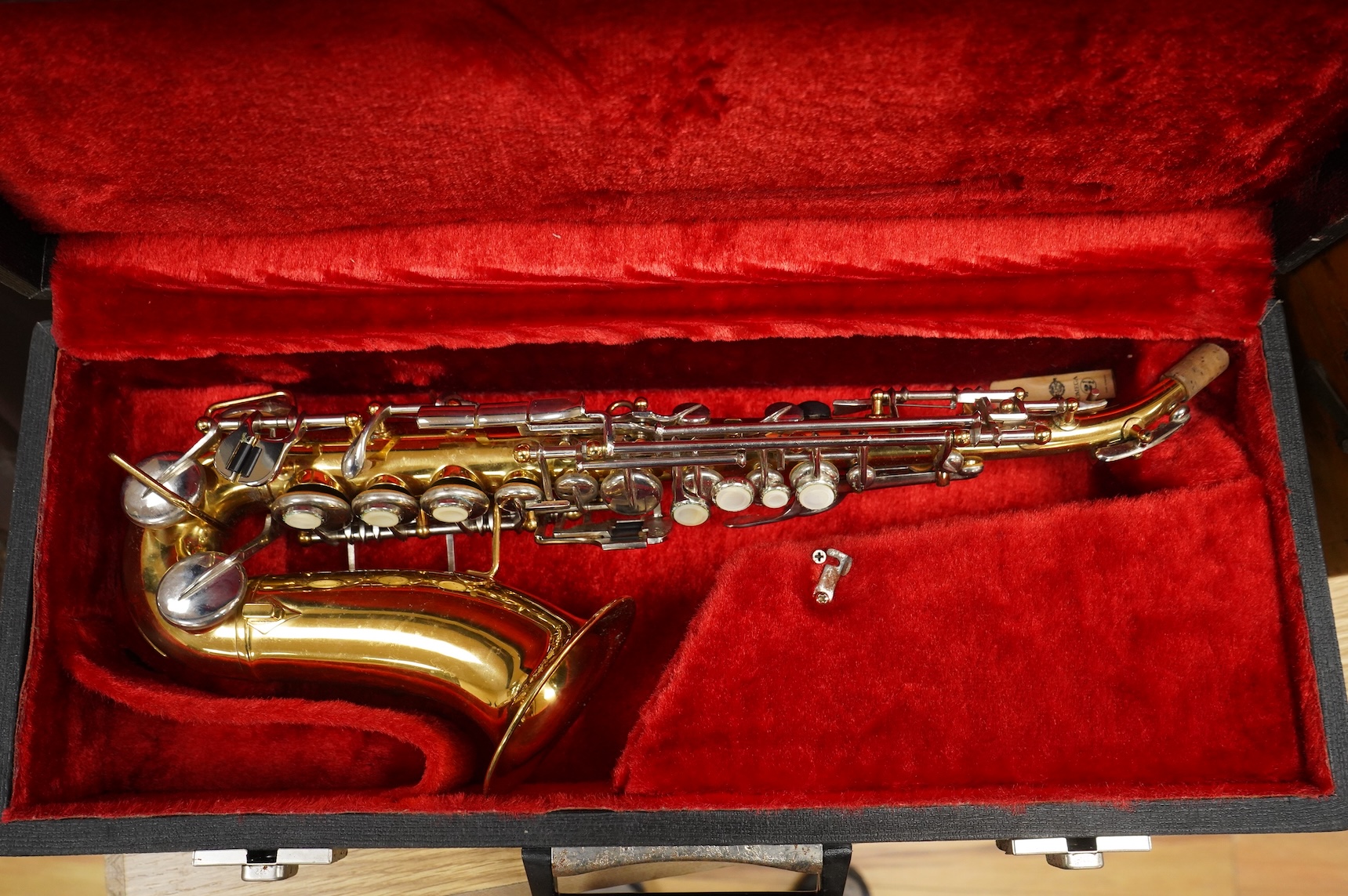 A cased Borgani soprano saxophone